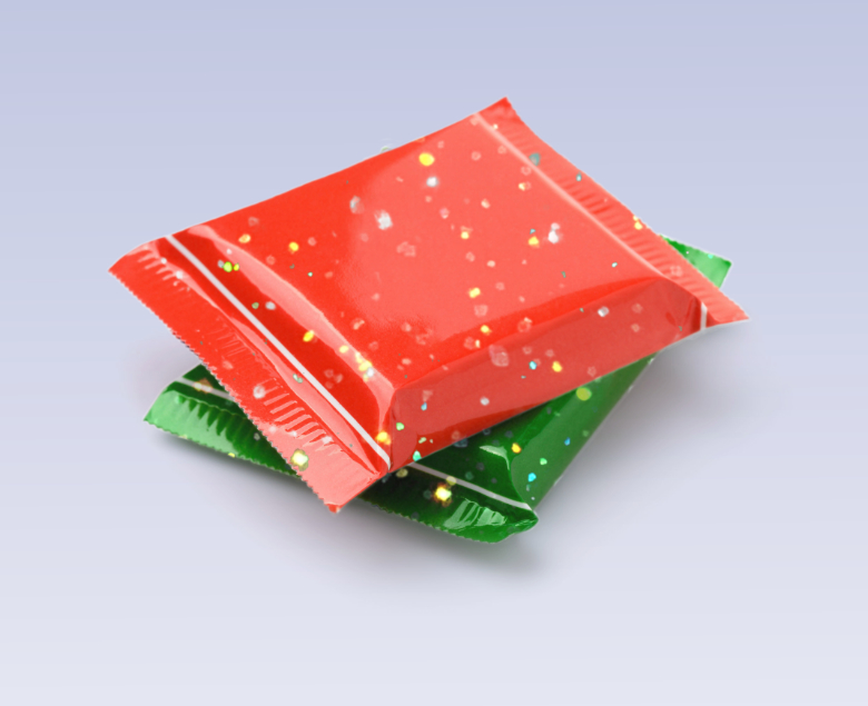Red and green  plastic chocolate packaging isolated on white